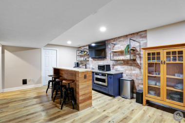 basement finishing ideas bar area with TV and island custom built