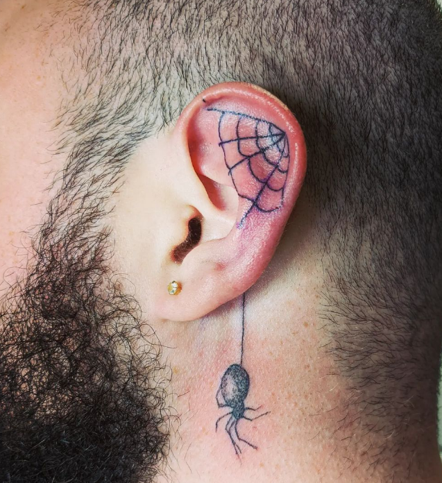Behind the ear tattoo