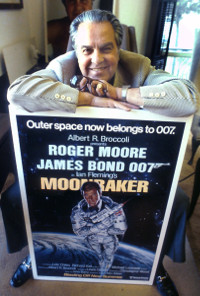 Albert R. Broccoli with a James Bond poster of Moonraker