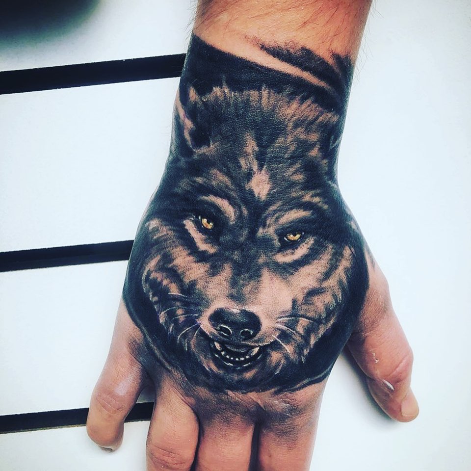 Pitch-black Wolf Tattoo On Hand