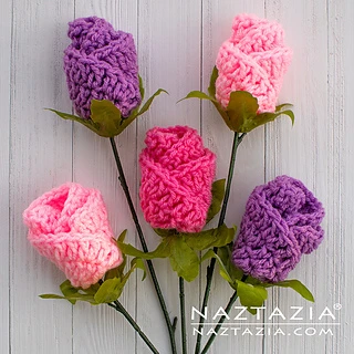 bouquet of crochet roses on wooden background