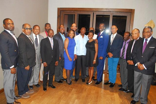 Haitian diaspora leaders with interim Haitian President Jocelerme Privert (middle in white shirt) last month in Port-au-Prince. (Dr. Joseph Baptiste behind Privert's right shoulder; Jean-Robert Lafortune second from left.)