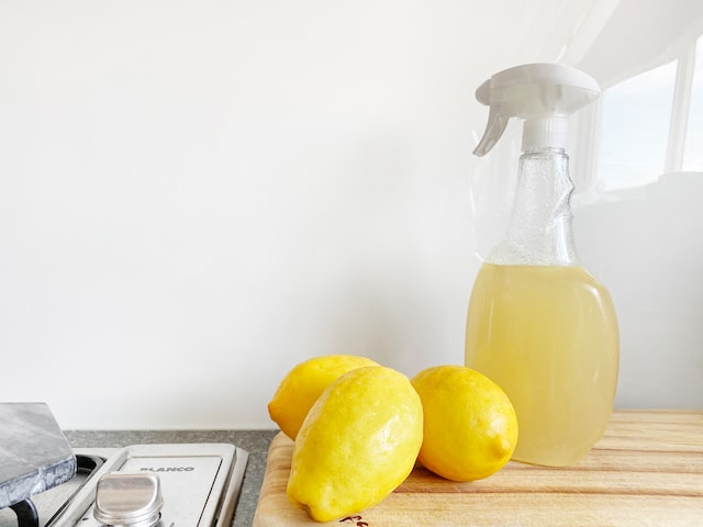 cleaning a kitchen with lemon juice