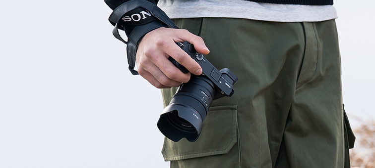 Image of man carrying camera in hand