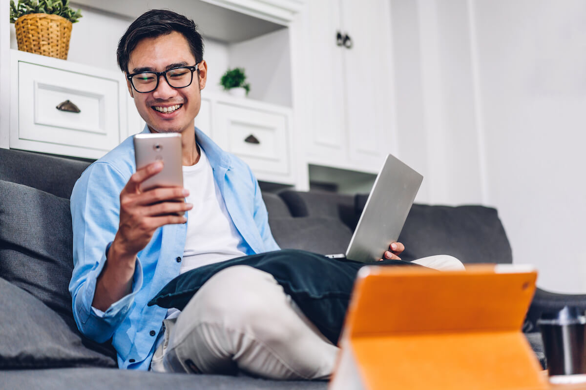 Patient appointment reminders: patient happily using a phone