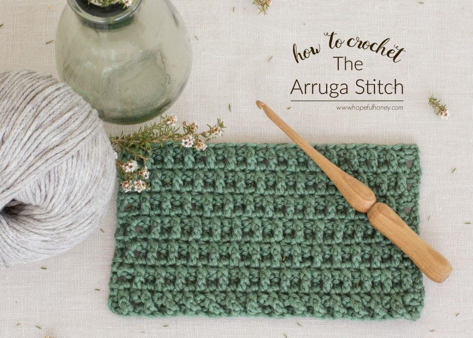 arruga stitch swatch with hook and yarn on white background
