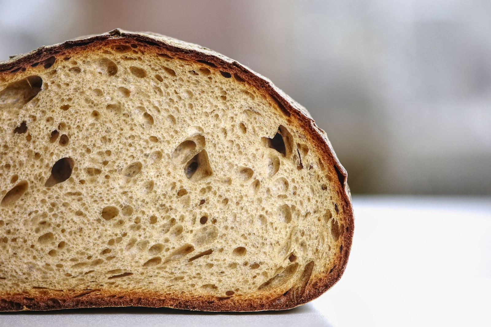 a closeup of a sliced loaf of sourdough bread from It's a Bakery.