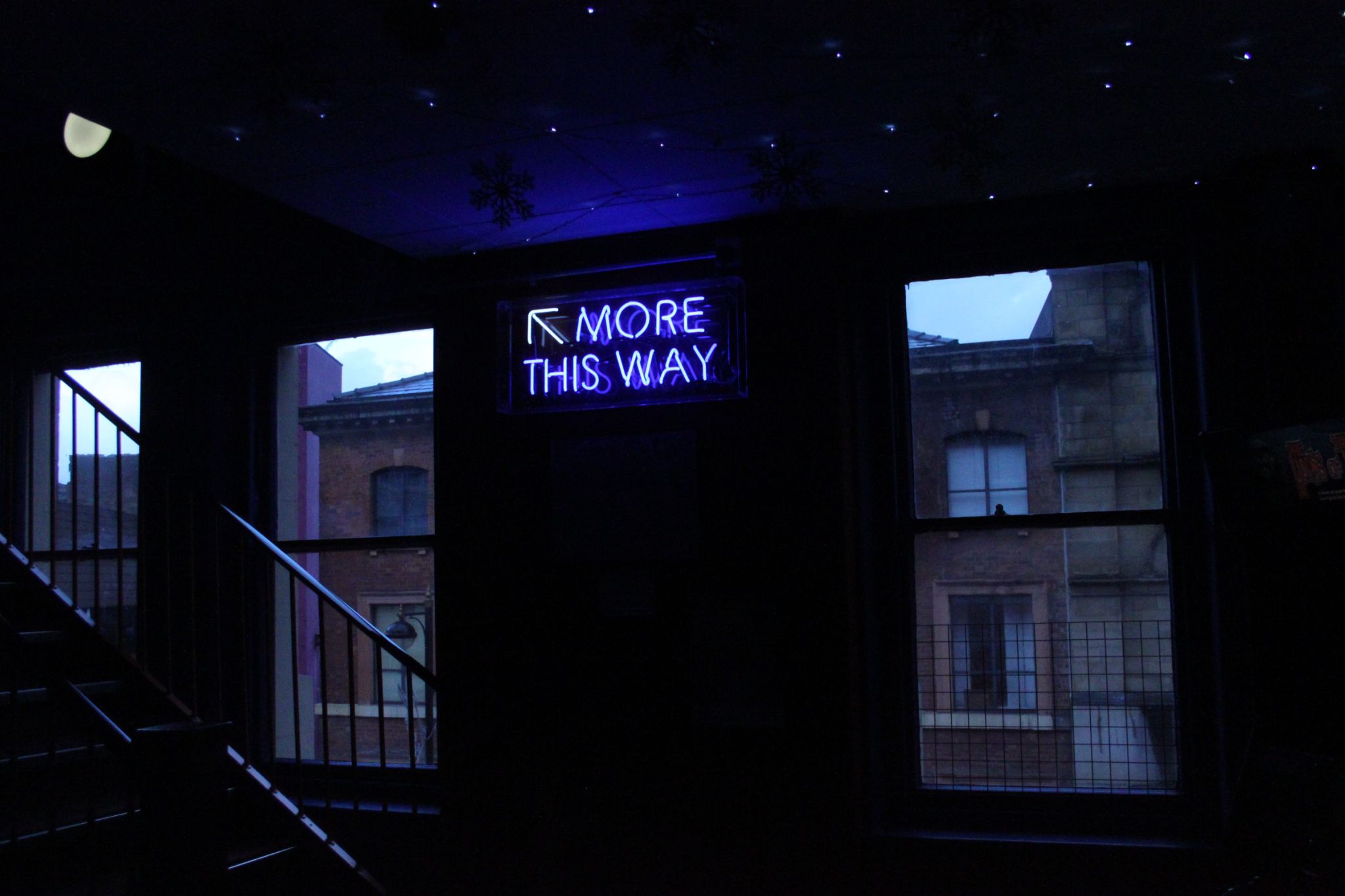 A picture of a neon sign that reads "More this way" representing that when readers click on 'more' in posts, it helps me.