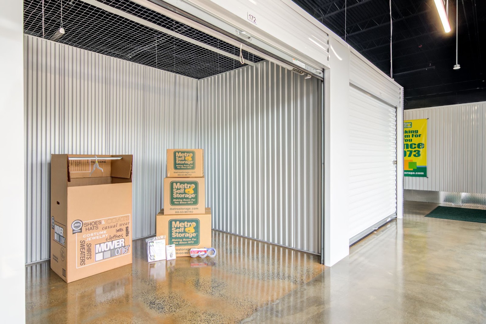 Indoor facility with door open and moving supplies inside. 