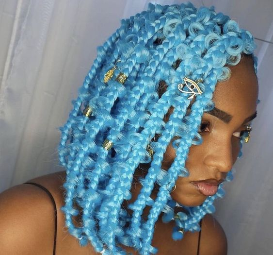 lady wearing blue butterfly braids with accessories