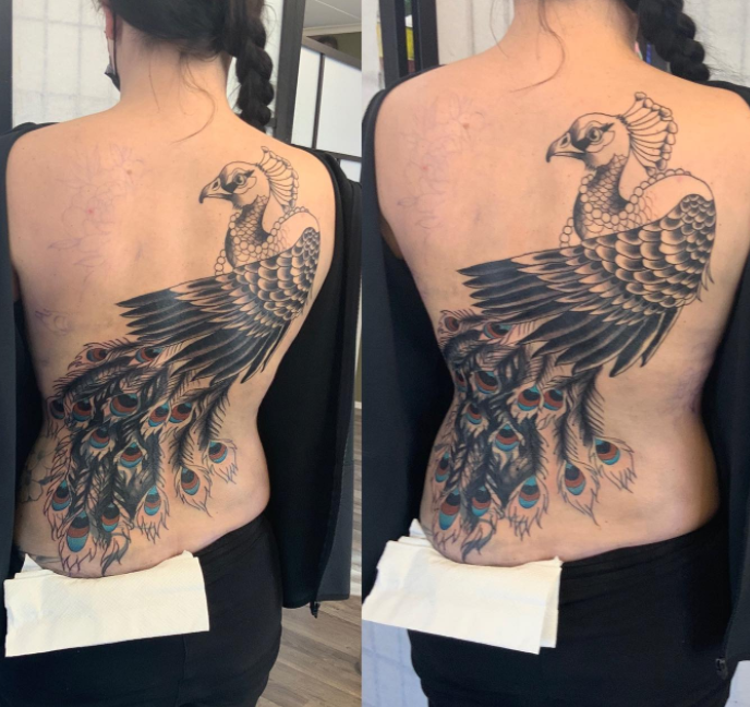 Elegant Black Peacock Tattoo