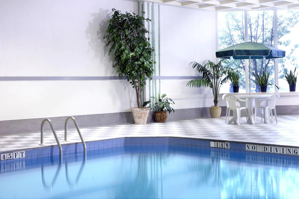 An indoor swimming pool at day time.