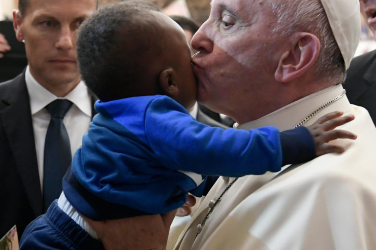 Pope kissing baby