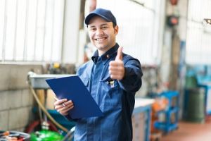 A worker showing a thumbs up sign