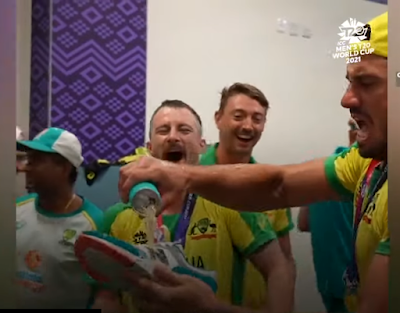 Australia won T20 world cup, celebrating by Drinking shampain by shoes.