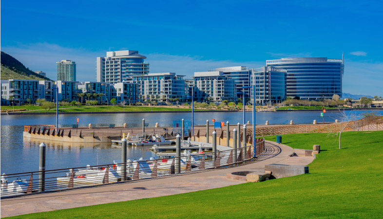 Salt River at Tempe Lake with the Tempe skyline under a clear, blue sky.