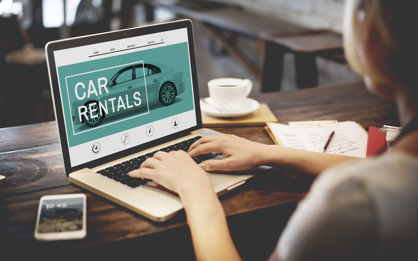 girl search for car rentals on laptop