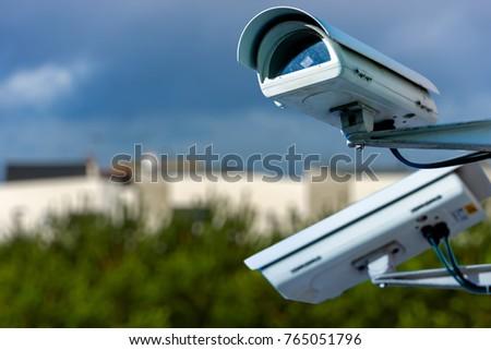 A security camera watching over a business