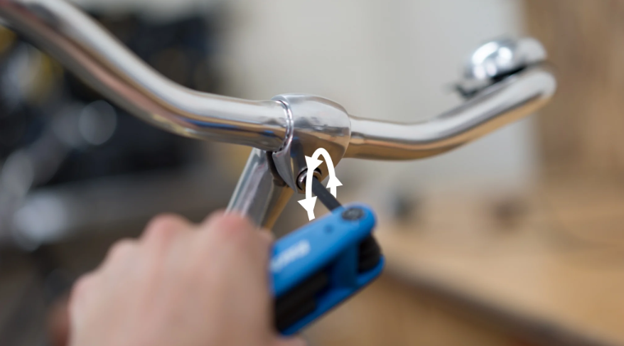 Loosen the locknut in a counterclockwise direction until the handlebar moves.