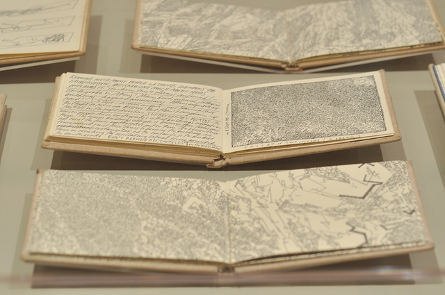 A view of various sketchbooks by Lebbeus Woods at the Drawing Center