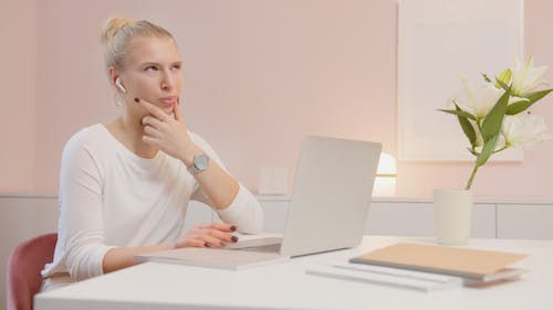 Free Woman Sitting in Front of a Laptop Stock Photo