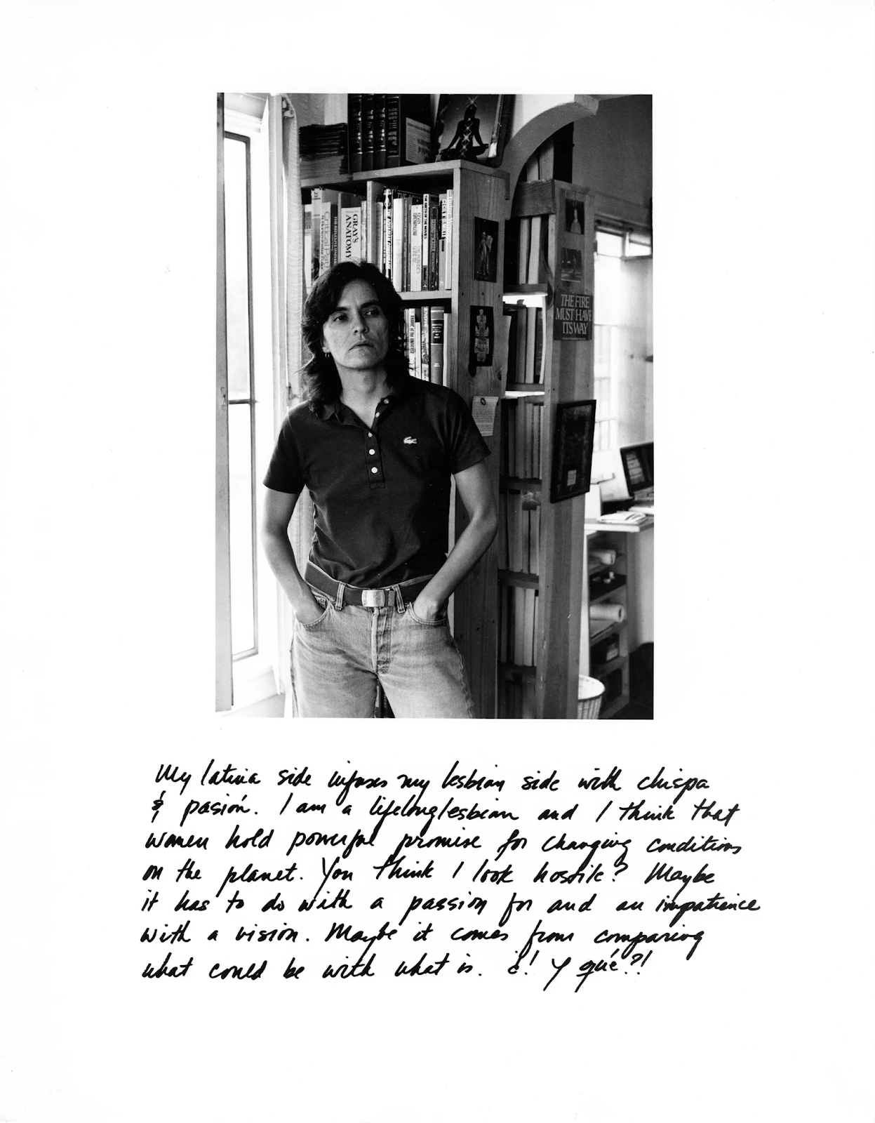 Laura Aguilar, Latina Lesbians - B&W image of woman in polo shirt, jeans, hands in pockets.