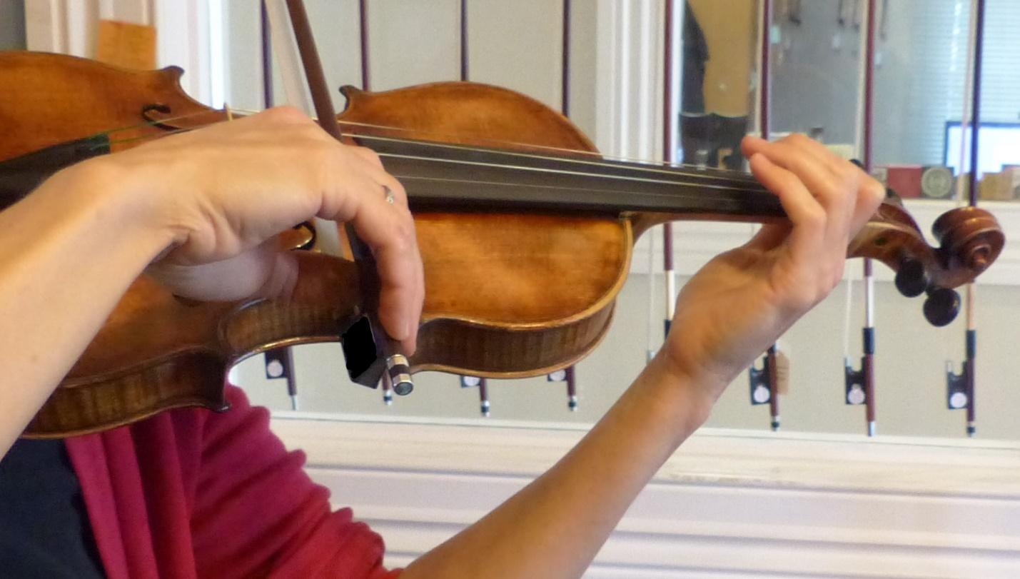 A person playing a musical instrument

Description automatically generated with low confidence