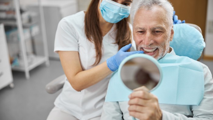 Patient examining teeth