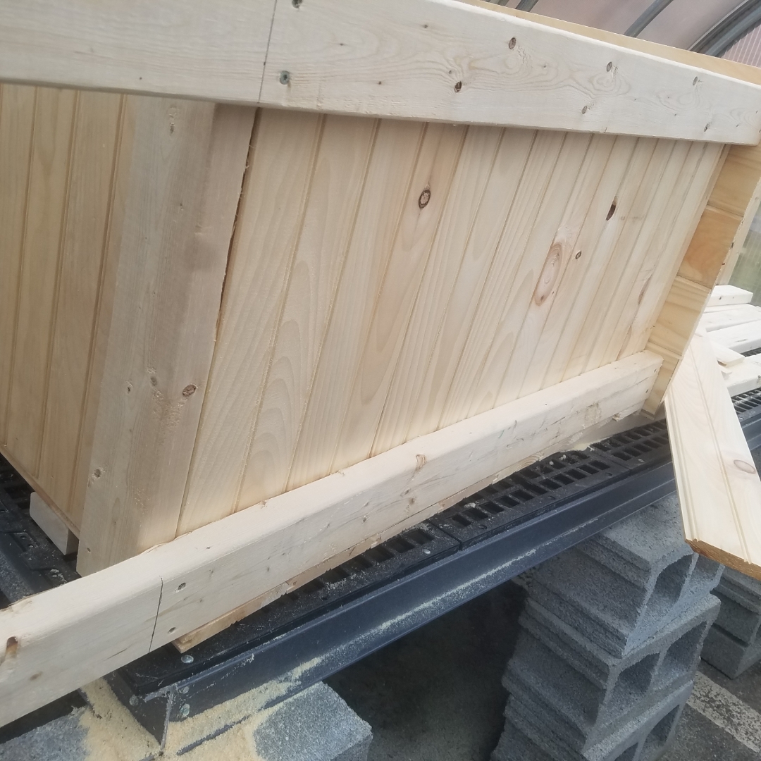 Wooden smoker being assembled