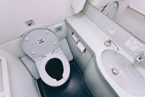 In case you were wondering how airplane restrooms work, try this site: https://thepointsguy.com/2018/01/how-airplane-toilets-work/