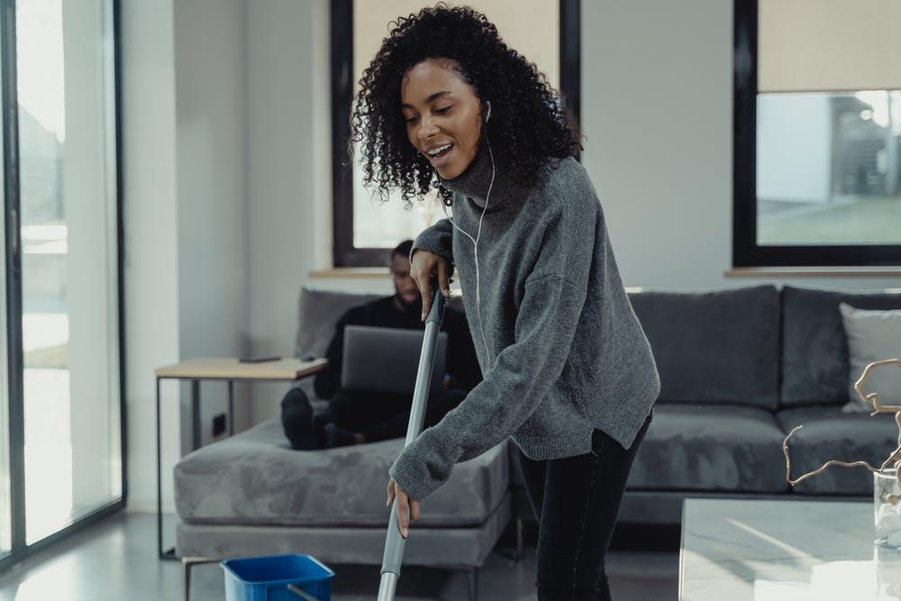 A Woman Mopping the Floor