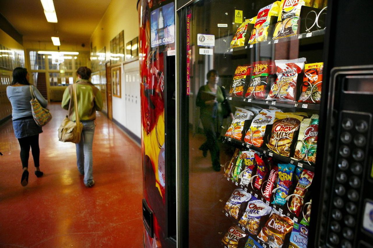 Candy vending machines in an establishment | Bottoms Up Vending