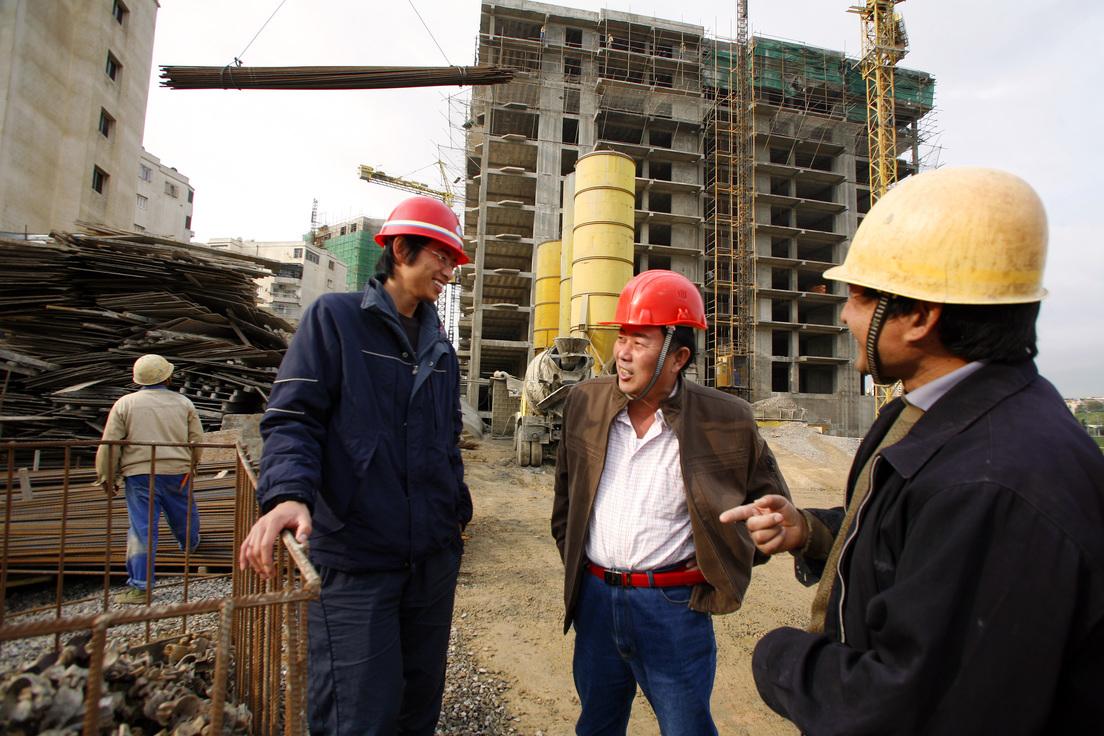 A group of men wearing hard hats

Description automatically generated with medium confidence