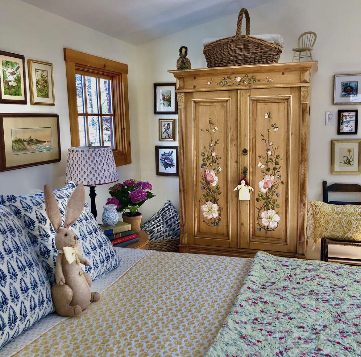 This kid's bedroom is a charming and inviting space that is both cozy and playful. The room is decorated in soft and soothing colors, with a few playful accents that reflect a child's sense of fun and imagination.The centerpiece of the room is a sturdy wooden bed with a comfortable mattress, outfitted with soft and inviting bedding in a mix of colors and patterns. A few throw pillows and a stuffed rabit add a touch of whimsy to the bed.Against one wall, there is a tall wooden cabinet. The cabinet is adorned with a few vintage art pieces and decorative accents, adding a touch of charm and personality to the space.Next to the bed, there is a small wooden table with a table lamp, providing soft and gentle lighting in the evenings. The table is perfect for holding books, toys, or other items, and adds a functional touch to the room.