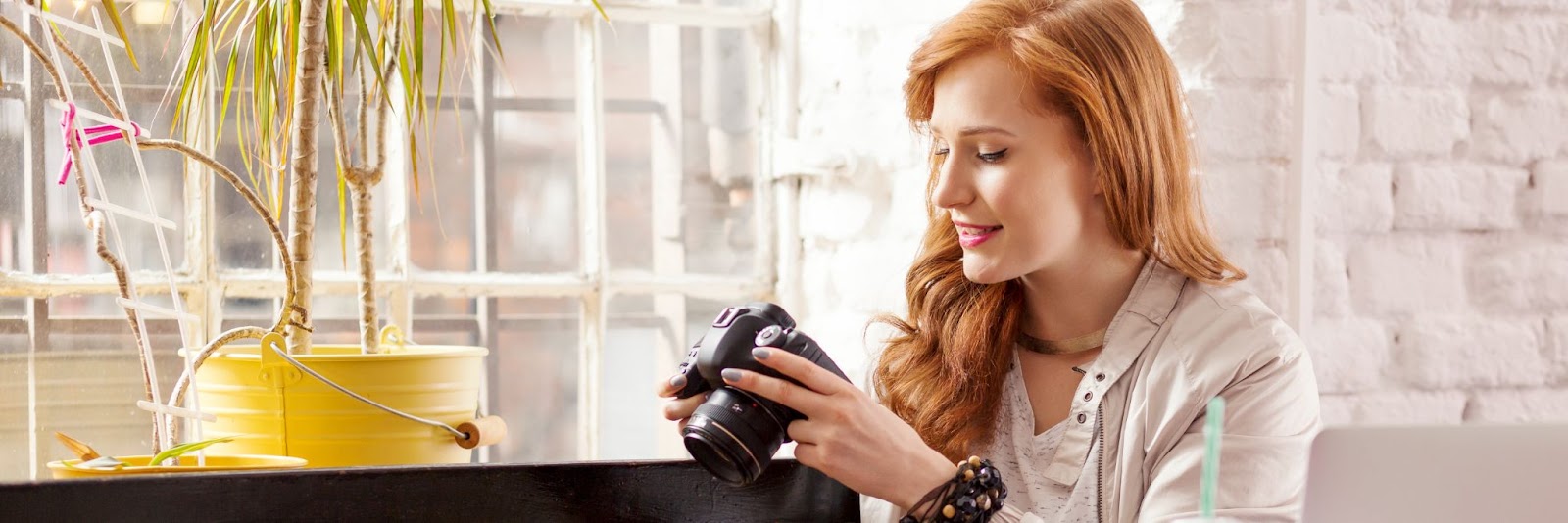 a woman looking at school video film on her camera