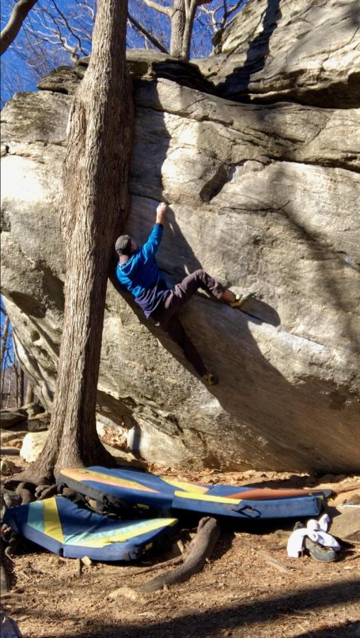 Desperately clawing my way up Dime Crack in Rumbling Bald, NC. Surely the world's hardest V4.