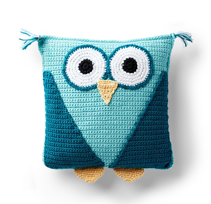 teal owl pillow on white background