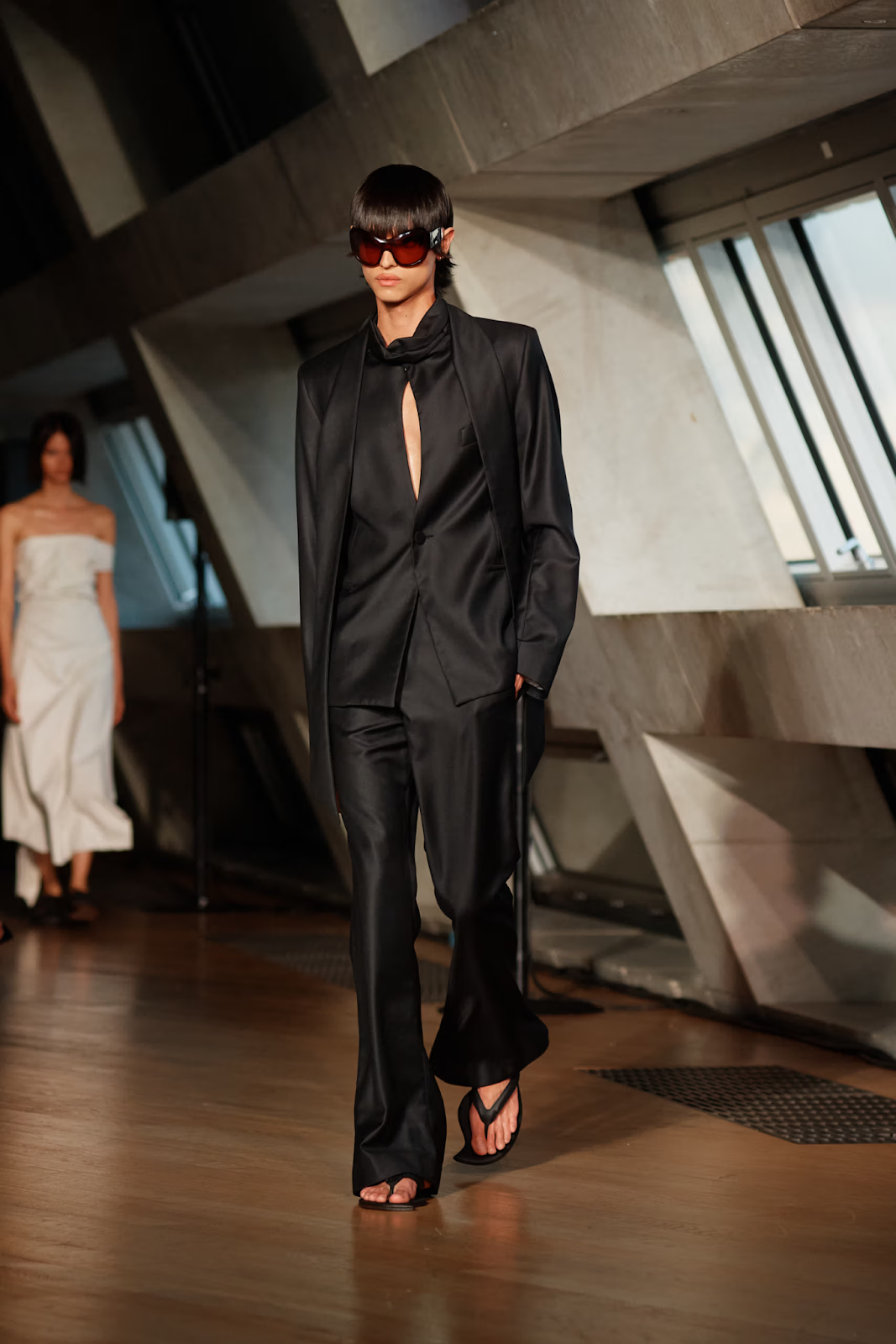 The gorgeous model rocks black suit and chic trousers for London fashion week 2023