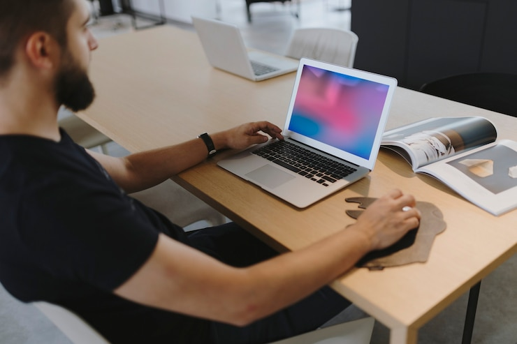 man using laptop