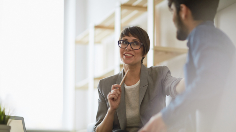 Man and woman talking in business office