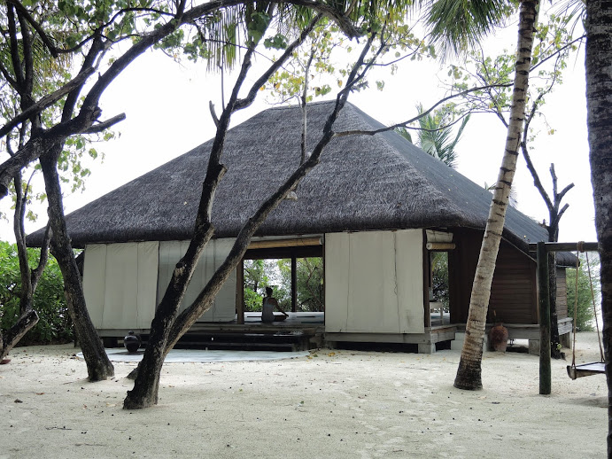 a person sitting in a hut