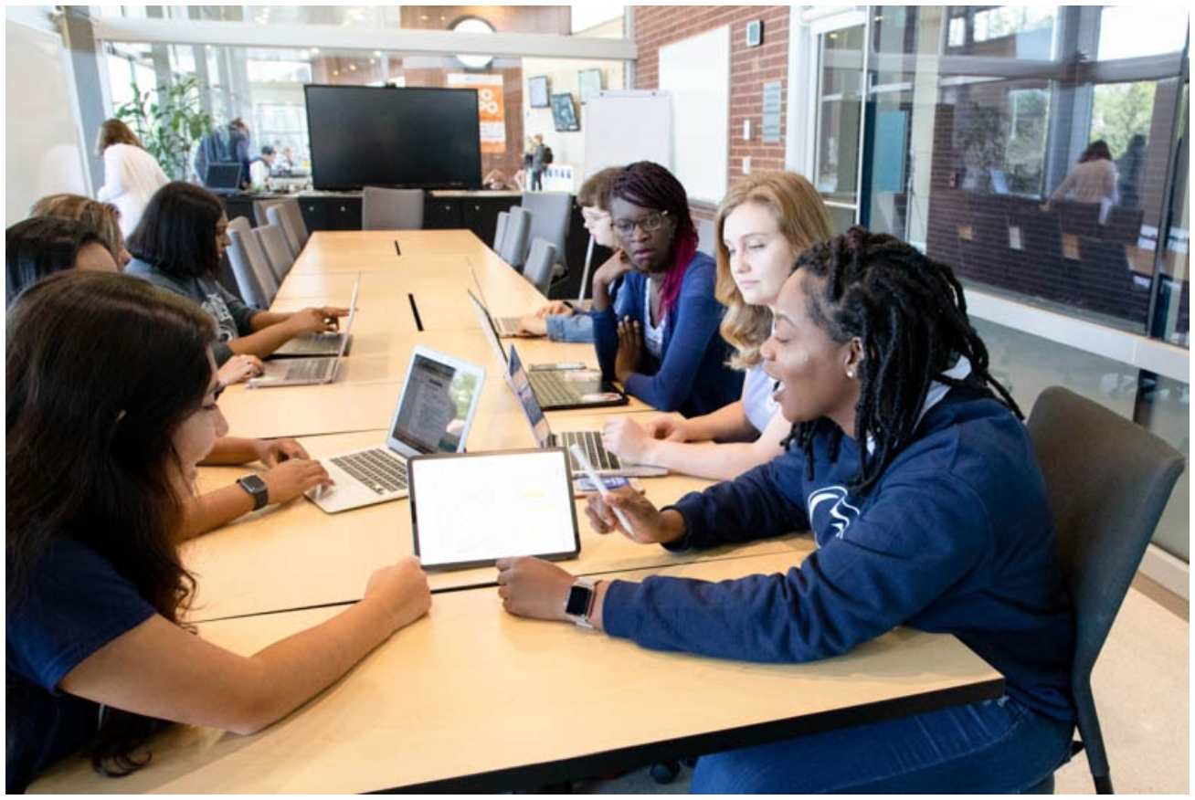 photo of I.S.T. students discussing a project.