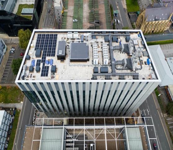 A computer sitting on top of a building  Description automatically generated