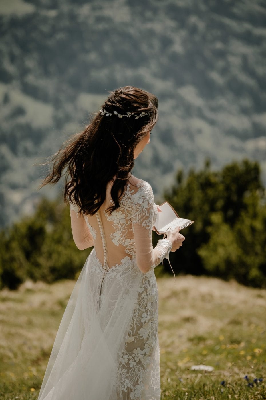 The bride with nature in the background going through her vows.