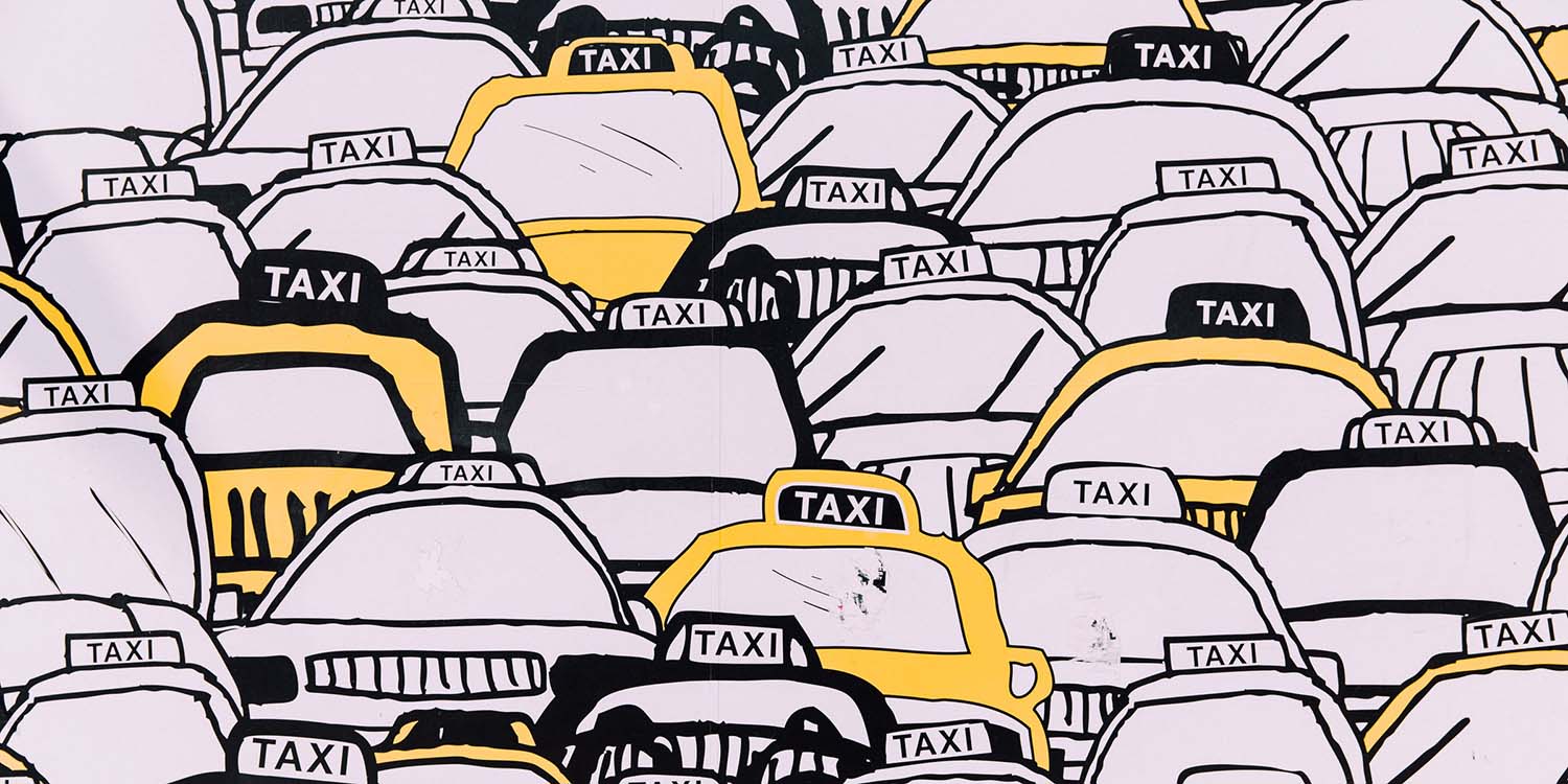 A graphic showing around 20 illustrated taxis that are white, black, and yellow.