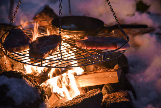Campfire Cooking While Winter Camping Near Kalle on Lofoten Archipelago in the Arctic Circle in Norw