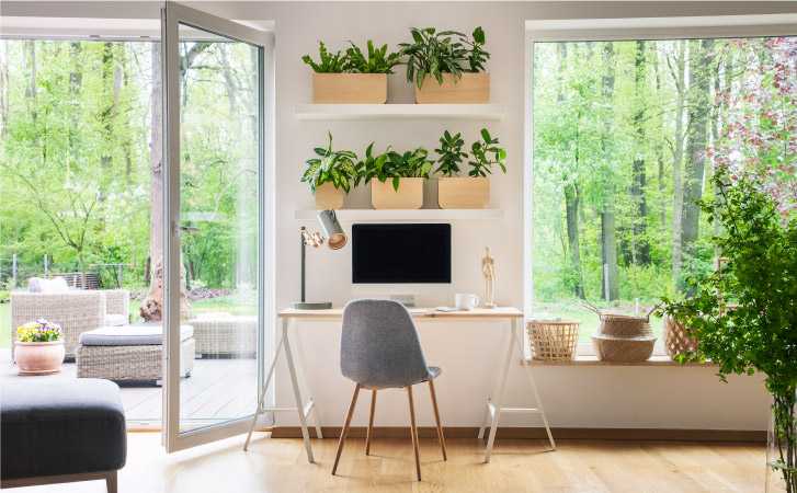 A home office surrounded by greenery