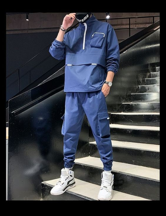 man wearing blue tracksuit outfit