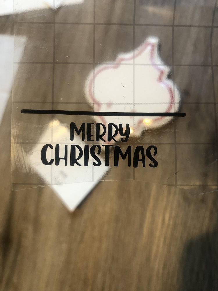 Apply vinyl text layer on Christmas ornament