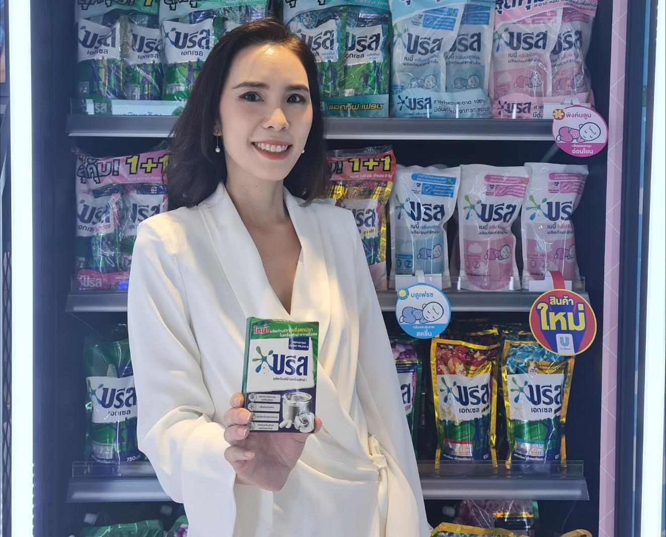 A picture containing text, person, store, vending machine

Description automatically generated